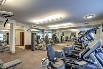 Fitness room with ample exercise equipment at 128 on State, Kirkland, 98033